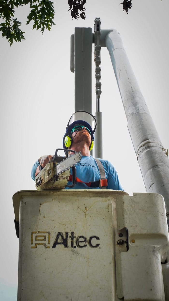Kohnen's crew member working from a bucket truck