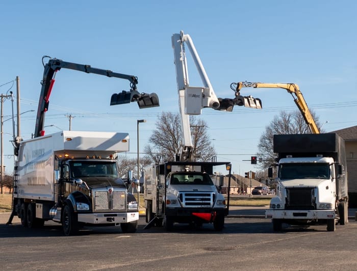 Kohnen's Tree Service fleet of grapple trucks ready for tree debris removal