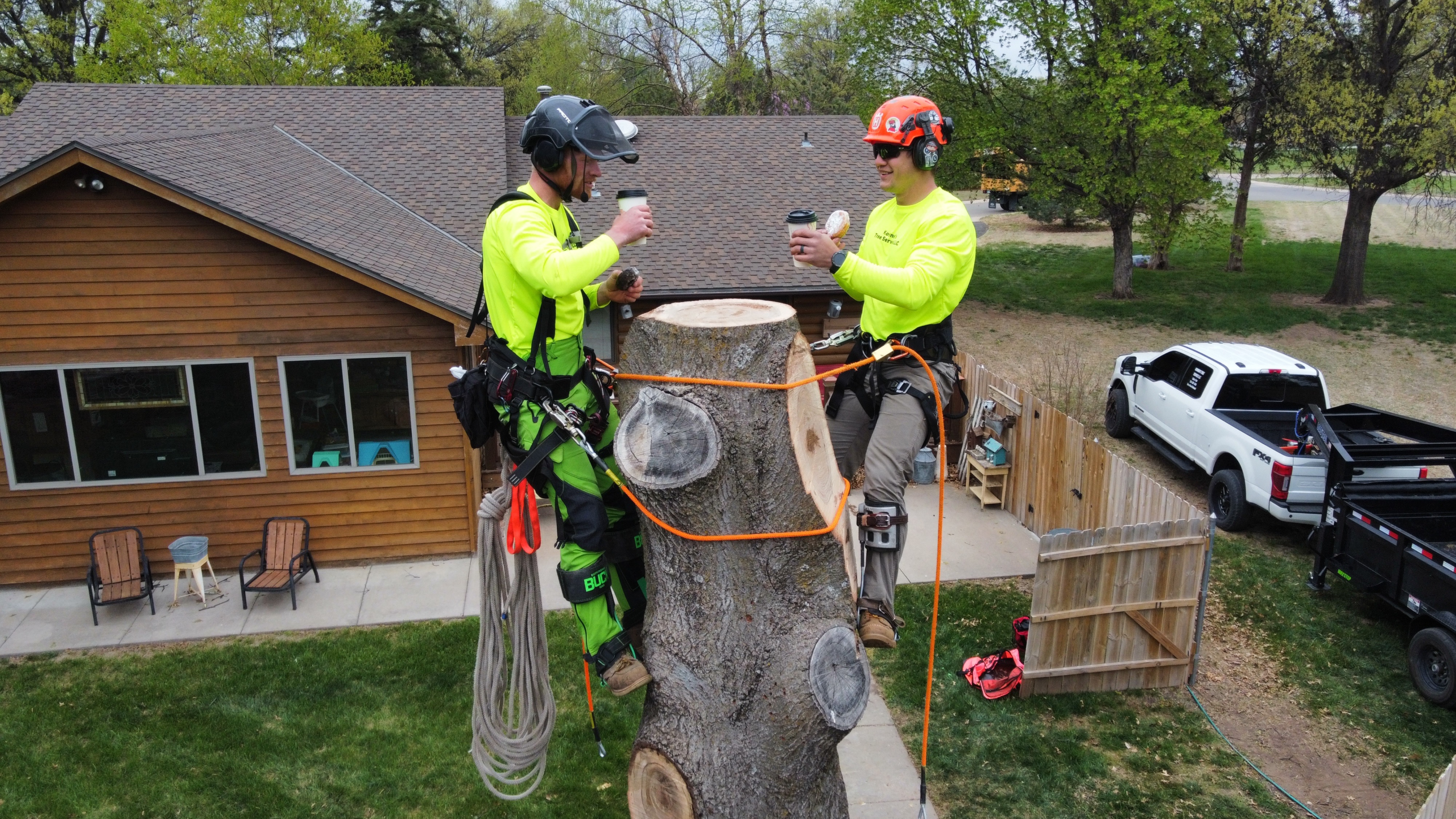 Storm-damaged property in Wichita requiring emergency tree removal after a large tree fell across a residential structure